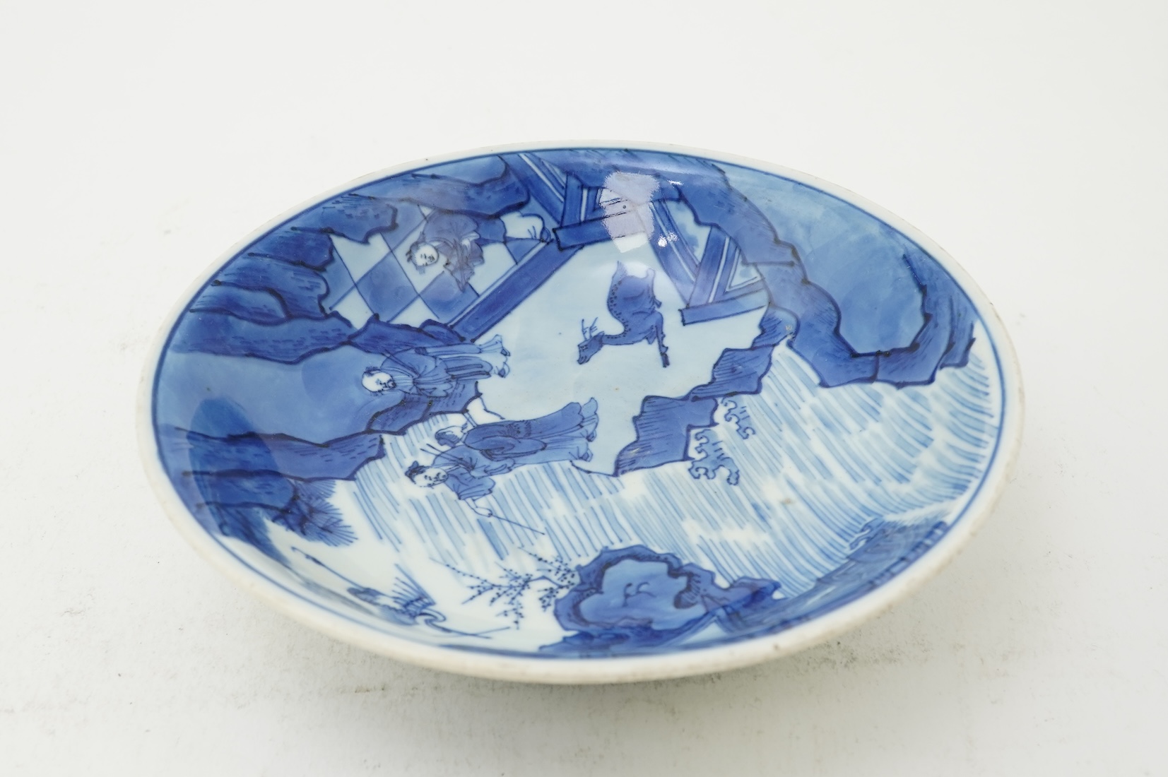 A Chinese blue and white saucer dish, Kangxi six character mark and of the period (1662-1722)